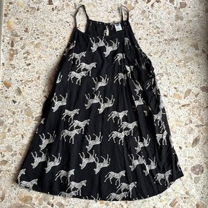 Like new condition! Year round zebra print flowy tank with no fading or pilling!